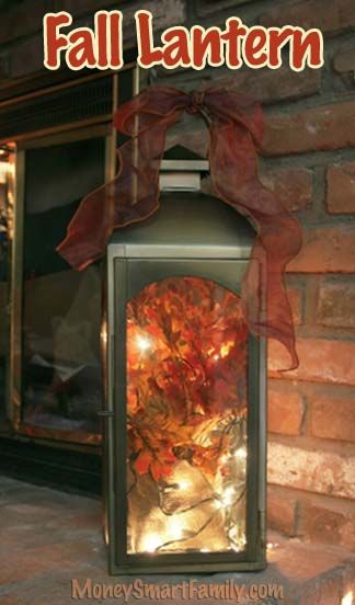 A DIY Autumn/ Thanksgiving/ Fall Lantern Decoration w/ Silk Leaves & White Twinkle Lights. How To Decorate A Lantern, Fall Lantern Decor Ideas, Lantern Gift Basket, Fall Broom, Fall Lantern Decor, Lantern Crafts, Fall Lanterns, Fall Tabletop Decor, Piano Decor