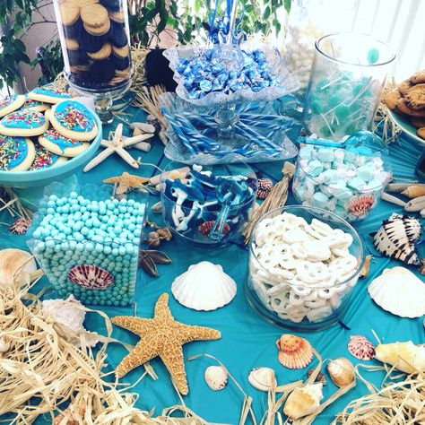 Beach themed party table with seashells and ocean blues Beach Theme Party Decorations, Beach Birthday Party, Beach Party Decorations, Sea Baby Shower, Shower Desserts, Sea Birthday Party, Mermaid Theme Party, Mermaid Baby Showers, Beach Themed Party