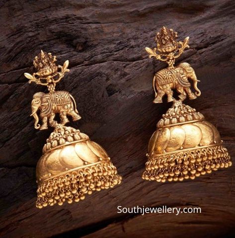 22k gold antique finish kasu jhumkas with Lakshmi and elephant motifs by Navrathan jewellers. plain gold buttalu designs 2020 Antique Earrings Gold, Antique Jumka, Temple Jewellery Jhumkas, Jhumka Design, Jumka Earrings, Temple Jewellery Earrings, Gold Jhumka, Gold Peacock, Gold Temple Jewellery