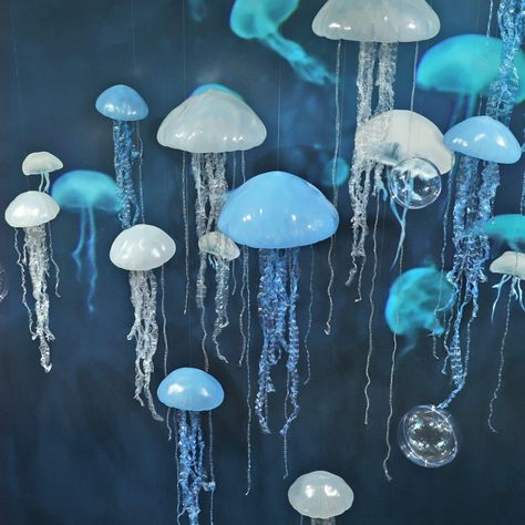 PRICES MAY VARY. Pvc Quantity: 1 pack of 1 jellyfish. A purchase quantity of 1 is 1 jellyfish. This jellyfish hanging prop is a stylish and chic marine theme decoration product, suitable for birthday parties, summer decorations and shop window decorations, it can create a mysterious and playful undersea atmosphere, ideal for place decoration. Hanging jellyfish are also perfect for banners for home, kid's room, playroom, shop window, school and kindergarten. They are also excellent decorations fo Ocean Theme Window Display, Ocean Classroom Decorations, Fish Themed 2nd Birthday Party, Shark Themed Birthday Party Decorations, Hanging Jellyfish Decor, Undersea Decorations, Under The Sea Birthday Party Decorations, Water Themed Birthday Party, Ocean Playroom