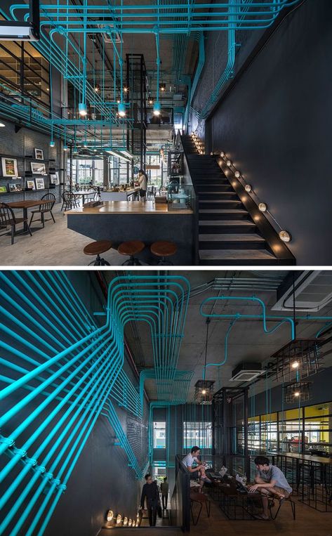 Turquoise electrical conduit is a design feature running through this office space Office Ideas For Work, Asma Kat, Industrial Office Design, Cool Office Space, Electrical Conduit, Design Café, 카페 인테리어 디자인, Space Interiors, Cool Office