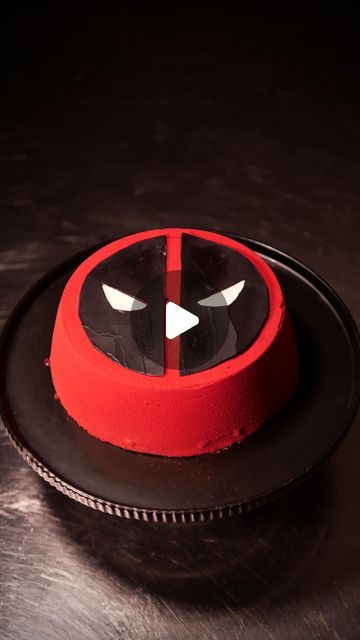 ANTHONY RANDELLO JAHN on Instagram: "Knead it, slap it, bake it. #DeadpoolAndWolverine 

I’ve come together with @marvelaunz to create a Deadpool inspired petit gateau mousse cake for the release of Marvel Studios’ Deadpool and Wolverine. 

DEADPOOL & WOLVERINE x DONUT DADDY

It features a delicious red and black brioche centre, ripe cherries blended into a sweet cherry jelly encased by chocolate mousse, and red velvet cocoa butter spray with tempered chocolate for the Deadpool icon on top. @vancityreynolds @thehughjackman 
 
Recipe:

Brioche 
Bakers flour:480 g3 3/4 cups
Sugar 50 g1/4 cup
Salt 10 g2 tsp
Instant yeast 10 g2 1/4 tsp
Eggs 5 large
Whole milk 60 ml1/4 cup
Unsalted butter, softened 225 g1 cup

For the Egg Wash:

Egg:1 large
Water:15 ml1 tbsp

Mousse 
Dark chocolate (70% cocoa): Deadpool Cake, Deadpool Icon, Tempered Chocolate, Cherry Jelly, Wolverine Deadpool, Deadpool And Wolverine, Frozen Cherries, Deadpool Wolverine, Egg Wash