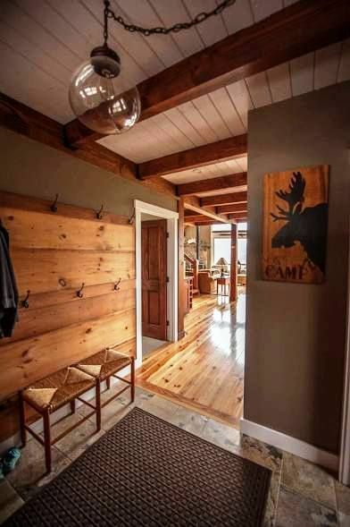 Mudroom to kitchen attached garage wall color gray warm greige A post and beam entry to a smaller mountain lodge style post and beam barn home. Post And Beam Barn Homes, Yankee Barn Homes, Cabin Living, Lodge Style, Lodge Decor, Post And Beam, Metal Building Homes, Barn Style, Cabin Homes