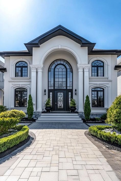 White mansion with tall arched windows and landscaping. Peek into the extravagant realm of luxury homes with insights on posh designs, exclusive features, and a sprinkle of real estate magic. Hangar Home, White Mansion, Classic Facade, Ideas De Casa, Castle Building, Classical House, Luxury Architecture, Houses Exterior, House Balcony Design