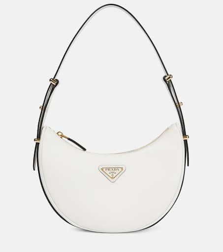 Arqué leather shoulder bag in white - Prada | Mytheresa Luxury Wishlist, Heeled Rain Boots, High Heel Rain Boots, Backpack Tote Bag, Boot Accessories, Leather Items, Tote Backpack, Free Bag, White Bag