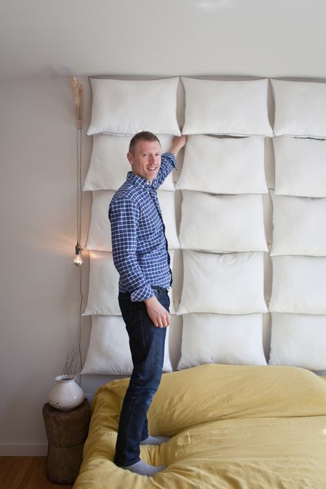 Dale Saylor and Joe Williamson of Hollymount DIY pillow headboard (an ode to Martin Margiele), photo by Michael A Muller | Remodelista Pillow Headboard Diy, Floating Headboard, Diamond Tufted Headboard, Pillow Headboard, Headboard Curtains, Glamour Home, Earthy Home Decor, Diy Pillow, Diy Window Treatments