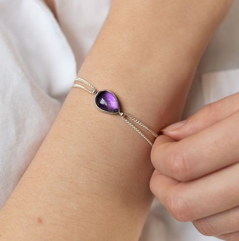 Stunning and vibrant smooth amethyst teardrop set in sterling silver on a chained bracelet. Contemporary and striking handcrafted chained bracelet with the essence of historical romance and a little boho chic! A stylish addition to your Winter wardrobe or a beautiful Bridesmaid Gift. Amethyst is the birthstone for February AMETHYST CHAIN BRACELET DETAILS Chain available in classic sterling silver or oxidised black silver chain. Please choose your metal options from the drop down menu. The bracel Chained Bracelet, February Gift, Purple Jewelry, Boho Bracelet, February Birthstone, Boho Gifts, Jewelry Gemstone, Historical Romance, February Birth Stone