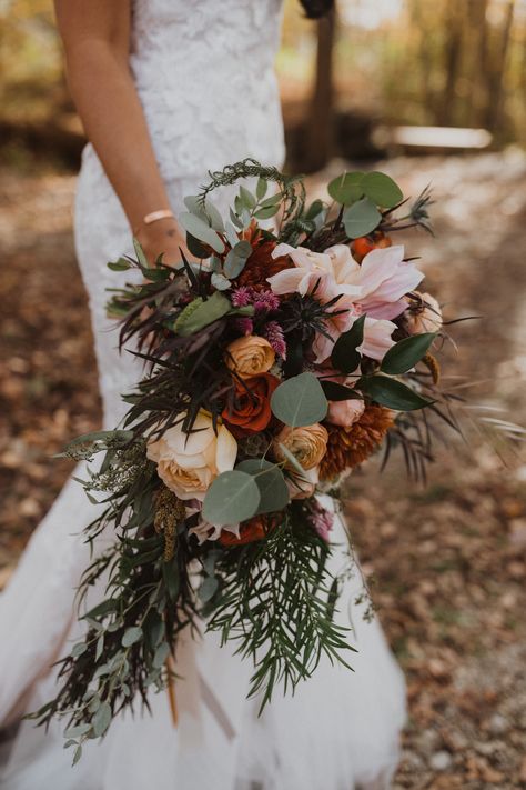 Cafe au Lait Dahlias and Garden Roses perfectly complimented this lush fall cascade bouquet.  #bohobride #bohobouquet #cascadebouquet #fallwedding #fallweddinginspiration #copperwedding Fall Cascading Bouquet, Dahlia Cascade Bouquet, Boho Cascading Bouquet, Fall Cascade Wedding Bouquet, Waterfall Bouquet Wedding Rustic, Cafe Au Lait Dahlia Bouquet, Cascade Wedding Bouquet, Cafe Au Lait Dahlias, Dahlia Wedding Bouquets