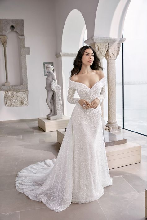 The Wedding Dress Designs That Every Bride Needs To See Off The Shoulder Fit And Flare Wedding Dress, Fit And Flare Wedding Dress Off Shoulder, Ronald Joyce Wedding Dress, Tight Wedding Dress With Sleeves, Off The Shoulder Sheath Wedding Dress, Wedding Dress Removable Sleeves, Detachable Sleeves Wedding Dress, Sequin Wedding Dress, Fitted Wedding Gown