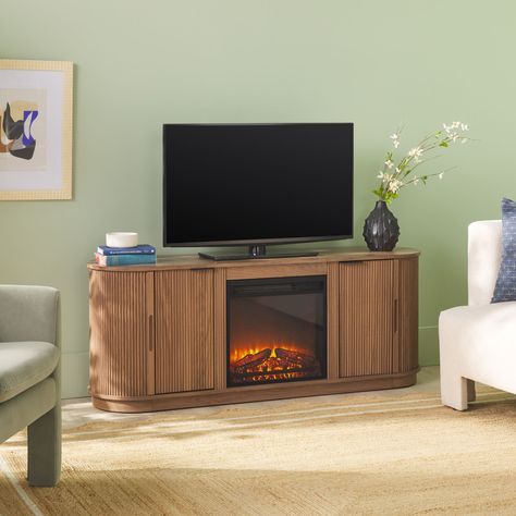 Grab the remote and blanket, because cozy nights in are about to get even better. This modern reeded fireplace TV stand brings warmth and stylish storage to any room in the home. Reeded, sliding wrap-around doors conceal your media devices, cords, and books, while the removable fireplace insert invites you to sit back and relax. Enjoy the welcoming flame with or without heat, from fall and winter all the way through spring and summer. Made from warp-resistant MDF and scratch-resistant laminate, Reeded Fireplace, Freestanding Electric Fireplace, Coastal Oak, Electric Fireplace Tv Stand, Electric Fireplace Insert, Living Room Entertainment, Fireplace Insert, Fireplace Tv Stand, Kitchen Dining Sets