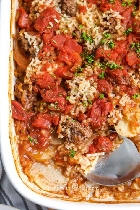 Hamburger Potato Casserole is the perfect one-dish meal. Layers of potato, onion, tomato, ground beef, and rice seasoned and baked until golden!  #spendwithpennies #hamburgerpotatocasserole #maindish #recipe #casserole #potatocasserole Easy Homemade Lasagna, Hamburger Potato Casserole, Hamburger And Potatoes, Stuffed Pepper Casserole, Layered Potato, Ground Beef And Potatoes, Casserole Easy, Hamburger Casserole, Hearty Casseroles