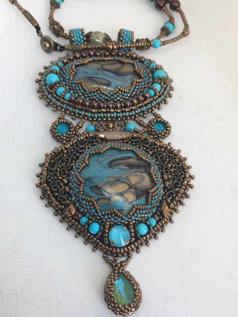 This embroidery necklace features one of a kind handmade cabochons, embellished with glass beads, chatons and rivoli.  The embroidery is done with the finest Japanese seed beads, Delicas and rounds of different sizes from Miyuki Toho and other Japanese designers.         This is a statement piece and is a little over 5" long and about 2.7" wide.  The "chain" is made of the Japanese seed beads and different glass rounds and roundels.  It measures a little under 19" and has a snap clasp closure.  The design is backed by natural leather for durability. Bead Embroidered Pendant, Far Rockaway, Embroidered Pendant, Beaded Work, Embroidery Necklace, Beautiful Beaded Jewelry, Embroidered Jewelry, Beading Inspiration, Jewelry Turquoise