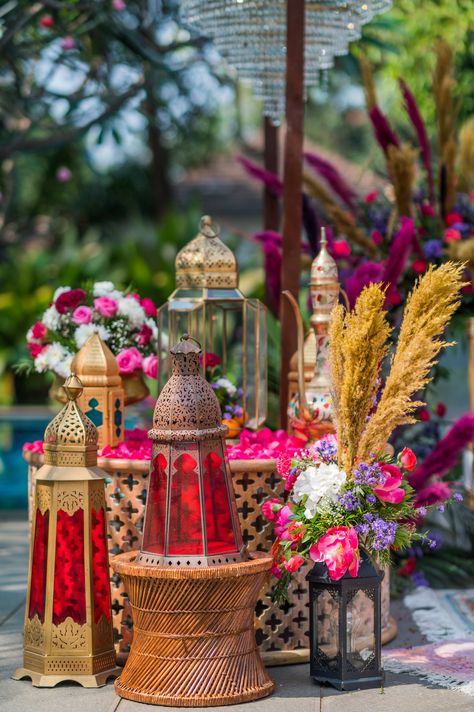 A boho themed mehendi with morroccan lanterns, with a pop of vibrant reds and pinks🌷 Sufi Theme Decor, Moroccan Theme Decor, Moroccan Wedding Decor, Sufi Night, Mehandi Function, Table Elements, Diwali Cards, Chandni Chowk, Moroccan Theme