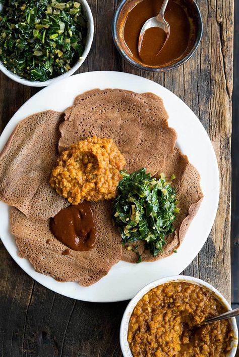 Injera  Adapted from Wild Fermentation by Sandor Katz   makes ~ 1 dozen (6 to 61/2-inch) injera 2 cups teff flour 1 cup sourdough starter 2 1/2 cups spring water 1/2 teaspoon salt 1/2 teaspoon baking soda olive oil for greasing the pan Teff Recipes, Teff Flour, Homemade Corn Tortillas, Spiced Butter, Pancake Recipes, Ethiopian Food, Nigella Seeds, Small Tomatoes, Lentil Stew