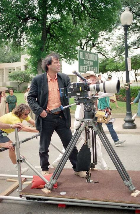 Oliver Stone gets a look at a camera angle for a motorcade scene in his film JFK in Dallas, Texas, on April 17, 1991. Roger Rabbit Characters, Robert Richardson, Oliver Stone, Fritz Lang, Kevin Costner, Film History, Martin Scorsese, Stanley Kubrick, Alfred Hitchcock