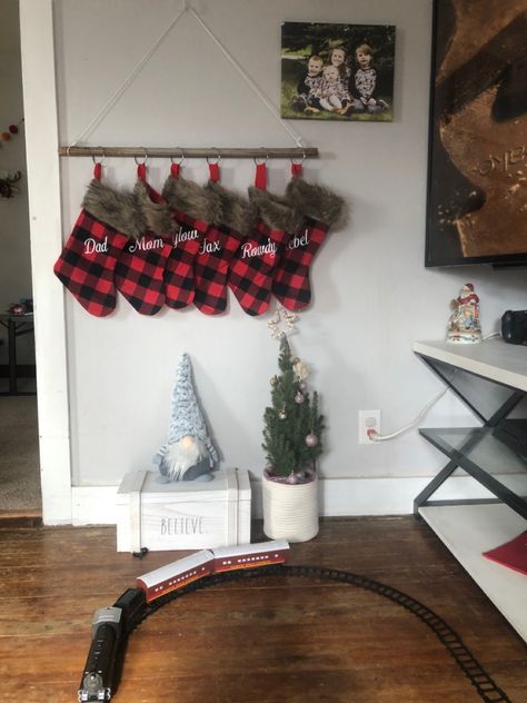 Hanging Stockings On A Branch, Hang Up Stockings Without Fireplace, Hanging Stocking Ideas Without Fireplace, Stocking Rack Diy, Hanging Stockings Ideas, Stocking Without Fireplace, Christmas Stockings Ideas Hanging, Hanging Stocking Ideas, Christmas Stockings On Wall