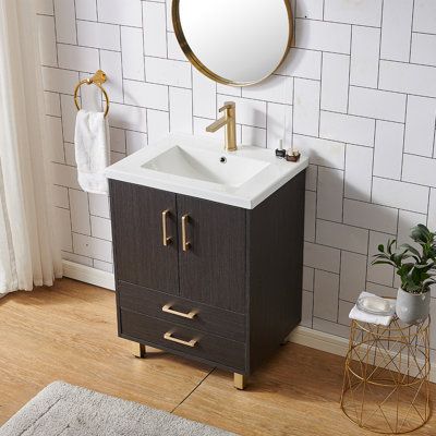 Upgrade your home's washroom with this freestanding black wood-grain bathroom vanity. Its sleek and simple design is perfect for those who want a simple and sleek look. The modern-style vanity features a smooth and warm appearance, adding a touch of character to the room. Perfect for small spaces, its small and smart design leaves plenty of floor space for you to maneuver around in. With its simple and bright colors, this bathroom vanity is sure to brighten and invigorate your room. With its ele Black Tile Bathroom Floor Wood Vanity, Washroom Vanity, Black Tile Bathrooms, 24 Inch Vanity, 24 Inch Bathroom Vanity, Powder Room Vanity, Small Bathroom Vanities, Small Vanity, Powder Room Small