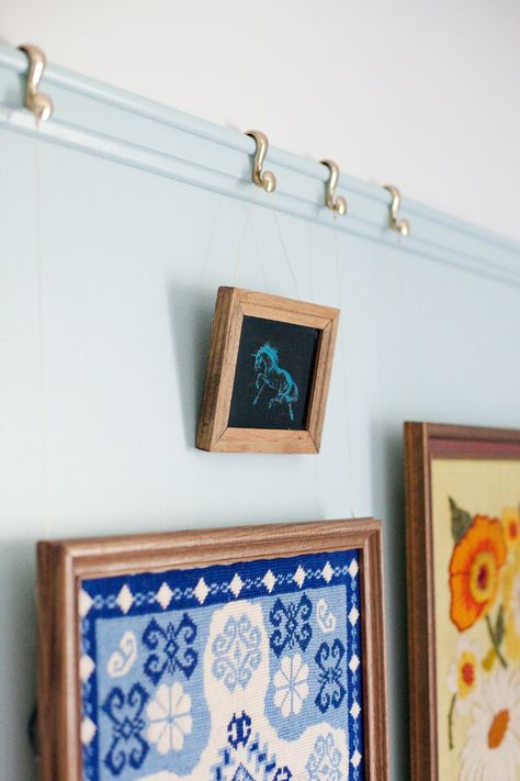 Decorative picture rail moulding adds a touch of character to any space. Click through for tips & a detailed how-to post. How To Make A Picture Rail, Picture Rail Molding On Walls, Diy Picture Rail Molding, Diy Picture Rail, Moulding Diy, Picture Rail Hanging, Art Hanging System, Picture Rail Molding, Picture Rails