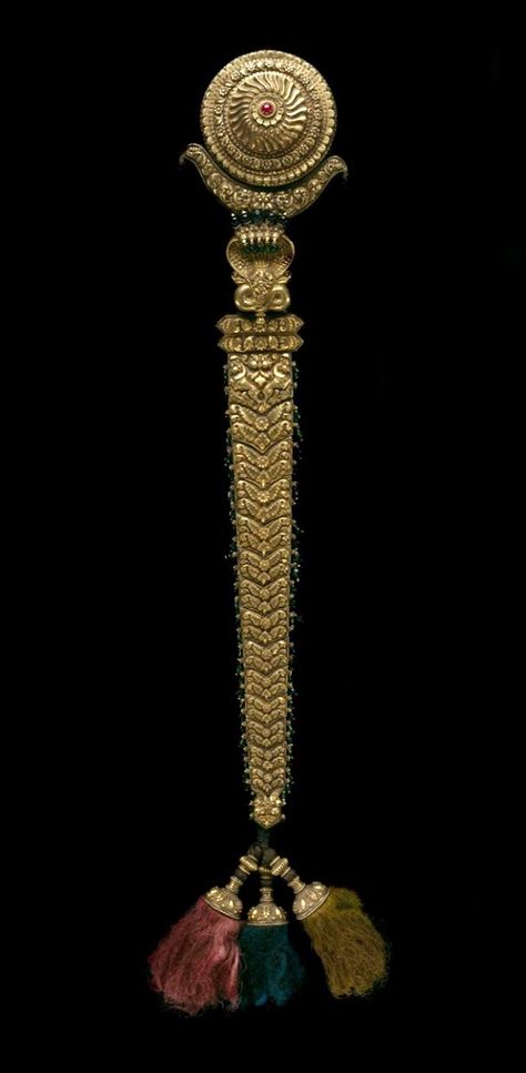 Indian, Hair Ornament, 19th century, Gold, gemstones, and cloth cord. | This superb and elaborate gold hair ornament terminates at one end in tassels and at the other end in many-headed cobras and the figure of Krishna. In Indian mythology, Krishna, the divine hero and eighth reincarnation of the major Hindu deity Vishnu, is said to have defeated the evil multiheaded serpent Kaliya that was poisoning the waters of the Yamuna River. Hair Accessories Indian, Indian Wedding Jewellery, Indian Bangles, Accessories Indian, Trendy Jewerly, Gold Hair Accessories, Bangles Indian, Gold Jewellery Design Necklaces, Indian Wedding Jewelry