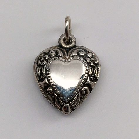 This antiqued sterling silver, two-sided, repousse Puffy heart Charm Number 27 features a mirror image of flowers, foliage, and clefs. Marked, Sterling. Made by Brown County Silver. Vintage and in new, never worn condition. Approximately 30 years old. 1/2" wide 1" high with jump ring. 1.7 grams approx. *Chain sold separately Antique Charm Bracelet, Vintage Statement Jewelry, Number 27, Brown County, Puffy Heart Charms, Pendant Heart, Gift Girlfriend, Anniversary Jewelry, Locket Charms