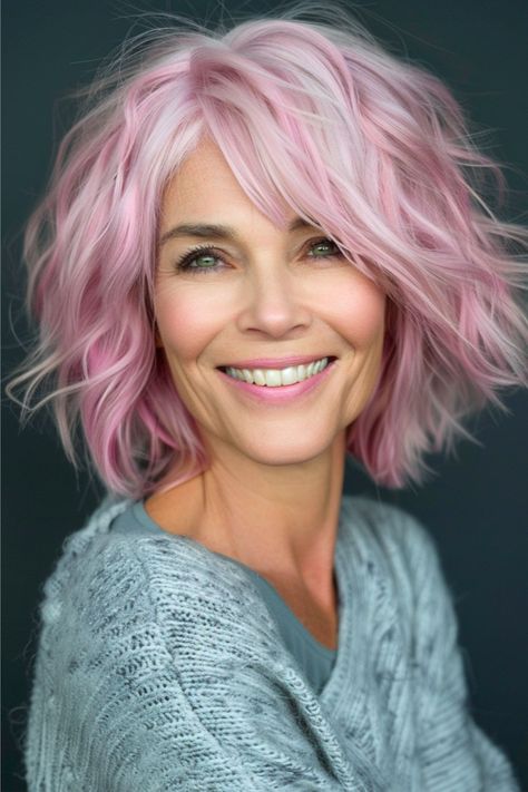 Dare to be different with this cool pink shaggy bob. The choppy layers and textured ends create an edgy vibe that's perfect for those looking to shake up their style. Click here to see more stunning shag hairstyles for women over 50. Dutch Side Braid, Short Haircuts With Bangs, Twist Box Braids, Side Swept Curls, Bubble Ponytail, Medium Layered Haircuts, Stylish Short Haircuts, Shag Hairstyles, Short Pixie Haircuts