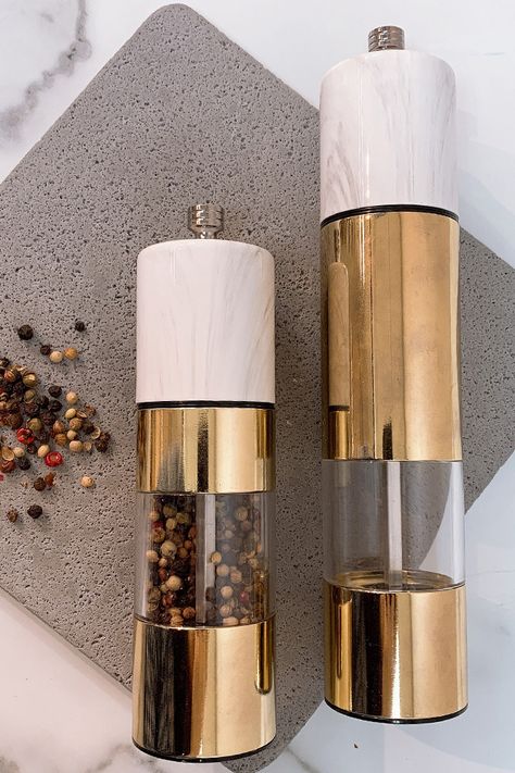 Gold Salt and Pepper Mill with Marble Finished #peppermill #saltmill #peppercorn #spice #aroma #freshfood Gold And Cream Kitchen Decor, Gold Kitchen Appliances, Gold Kitchen Decor, Gold Kitchen Accessories, Kitchen Appliance Storage, Gold House, Amazing Tools, Kitchen Accesories, Salt And Pepper Mills