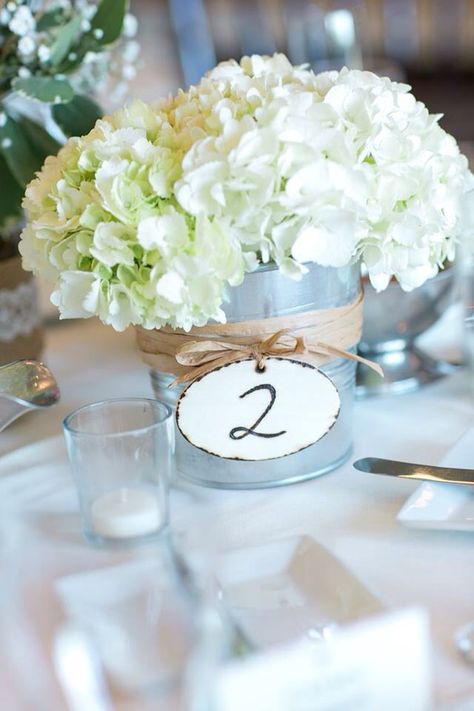 Tin pail centerpieces Tin Anniversary Party, Metal Bucket Centerpieces, Tin Pail Centerpiece, Tin Bucket Centerpiece, Bucket Centerpiece Ideas, Tin Centerpieces, Tin Can Centerpieces, Bucket Wedding, Bucket Centerpiece