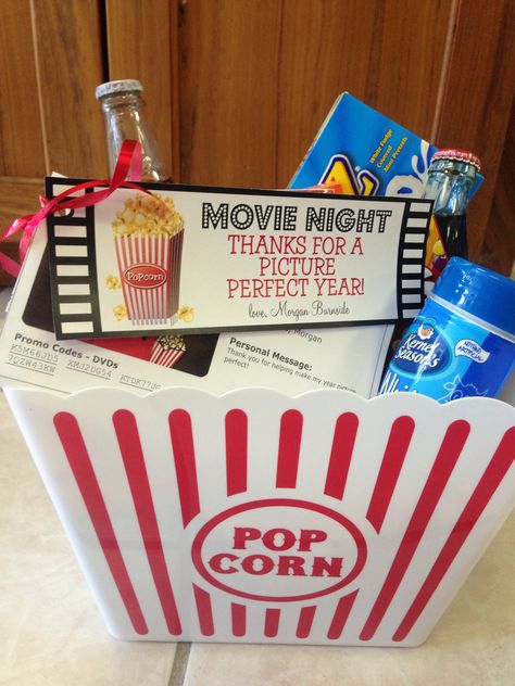 Perfect teacher gift-movie night. I got popcorn buckets from dollar tree along with assorted candy boxes and popcorn. I also added a glass bottle of cheerwine and coke to complete the bucket. Lastly I added 5 #Redbox promo codes for free DVD rentals. I did these online and got 5 codes for $6. The teachers loved these and were a hit! #movienight #redbox #teachergifts #cheerwine #coke Movie Night Teacher Appreciation Gift, Dollar Tree Popcorn Buckets, Teacher Appreciation Gifts Popcorn, Movie Bucket Gift Ideas, Teacher Appreciation Gifts Dollar Tree, Popcorn Bucket Gift Ideas, Popcorn Teacher Gift, Teacher Apperication, Bucket Gift Ideas