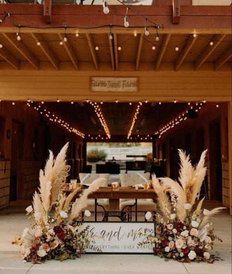 Burgundy Wedding Country, Country Glam Wedding Decor, Western Floral Arrangements Wedding, Sweetheart Table Fairy Lights, Western Wedding Centerpieces Wedding Table Decor, Wedding Head Table Ideas Boho, Bride And Groom Table Western, Burgundy Boho Wedding Decor, Sweetheart Table Wedding Pampas