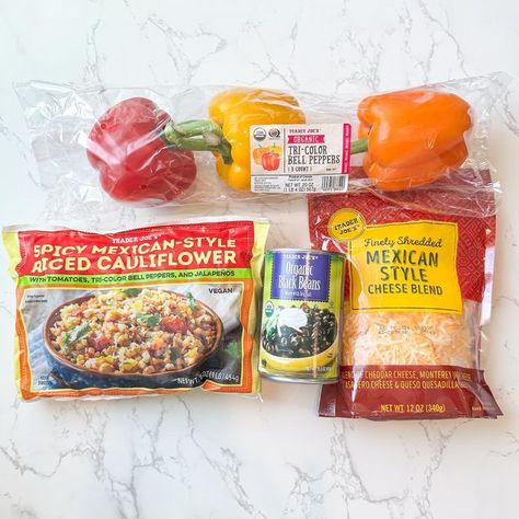 Anna Lisa | Trader Joes 5 Items or Less Recipes on Instagram: "These spicy stuffed peppers filled with Mexican cauliflower rice, beans and cheese make a great Meatless Monday dinner or side dish! But they are 🌶️spicy🌶️ (but so good!) so don’t say I didn’t warn you! 😜

Ingredient 
Tri-color bell peppers
1 can black beans
Spicy Mexican style cauliflower rice
Shredded Mexican cheese

Preheat the oven to 375. Cut the bell peppers in half and remove the seeds. Place them on a sheet pan and drizzle them with olive oil and add sea salt. Bake them in the oven for 15 minutes. While those are baking, heat 1 tablespoon of olive in a large pan, then empty the entire package of cauliflower rice and cook for 12 min. Rinse and drain the can of beans, then add them to the cauliflower rice, along with s Mexican Cauliflower Rice, Mexican Cauliflower, Monday Dinner, Beans And Cheese, Meatless Monday Dinner, Trader Joes Food, Can Black Beans, Trader Joes Recipes, Rice Beans