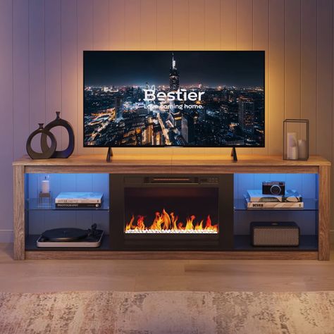 PRICES MAY VARY. Dimensions: TV stand 71" W x 20" H x 13.8"D, suitable for 75 inch tv. Electric fireplace: 23" W x 17" H. (The tv stand and electric fireplace come with two packages) Electric Fireplace: The fireplace features 5 changeable flame colors & 5 levels dimmer, set with temperature controller & timer to maintain air humidity. The upgraded fireplace is combined with flame and crystal to warm your room faster in a healthy way. LED Light: The tv stand itself come with 7 main colors and 22 Tv Stand Decor Ideas, 75 Inch Tv, 70 Inch Tv, Electric Fireplace Tv, Shelves For Living Room, Fireplace Entertainment Center, Tv Stand Decor, Fireplace Entertainment, Electric Fireplace Tv Stand