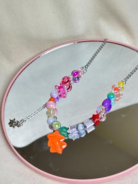 Brighten up your look with this eye-catching indie-style necklace!  🤍Handcrafted necklace with colorful beads. 🤍Indie style, perfect for layering or wearing solo. 🤍Unique design for a creative, boho aesthetic. 🤍Great for festivals, casual outings, or expressing your personal style. 🤍Ideal gift for lovers of eclectic and artsy jewelry. 🤍Stainless steel chain  🤍Length: 42cm + 3,5cm chain PLEASE NOTE ౨ৎ ⚜️Made with love and care.  Every piece at SAMA is handcrafted with attention to detail, Indie Necklace, Artsy Jewelry, Indie Style, Boho Aesthetic, Necklace Unique, Handcrafted Necklace, Indie Fashion, Unique Necklaces, Accessories Unique