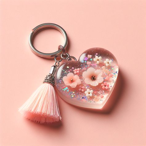 Adorable heart-shaped resin art keychain designed for a sophisticated yet fun-loving teenager. Filled with pastel-colored glitters and tiny dried flowers, complemented with a silver keyring and a subtle pastel tassel charm.

#ResinArtKeychain #TeenAccessories #PastelKeychain #ChicKeychain #ResinArt #FloralKeychain Gantungan Kunci Resin, Resin Art Keychain, Resin Idea, Resin Inspiration, Art Keychain, Pastel Heart, Heart Resin, Resin Ideas, Diy Resin Art