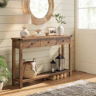 Transform your space with this exquisite console table that exudes farmhouse charm with its wood-effect finish, sleek lines, and elegant metal accents. Featuring 1 tabletop, 3 drawers, and 1 open shelf, this entry table ensures your belongings are neatly stored. Constructed of particleboard, solid wood, and MDF panels, this narrow entryway table can support up to 110 lb on the tabletop and 22 lb in each drawer. Whether in the hallway, living room Narrow Entryway Table, Industrial Console Tables, Console Table Decorating, Hallway Console, Entryway Table Decor, Wooden Console Table, Table Decorating, Wooden Console, Solid Color Rug