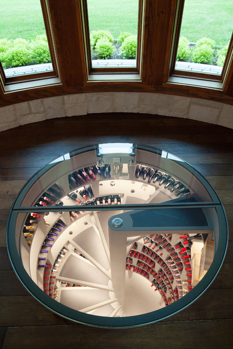 in floor wine cellar with leather steps by Genuwine Cellars Leather Stairs, Round Glass Door, Glass Entry Door, Spiral Wine Cellar, Staircase Glass, Entry Doors With Glass, Custom Wine Cellars, Wine Preserver, Premium Wine