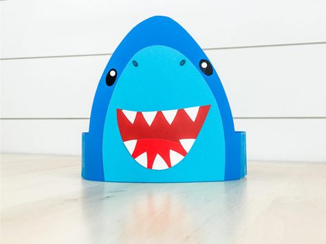 After you make your shark shirts, you're going to need a hat to go with it! This cute shark headband is a fun craft your kids can wear when they're finished making it. Shark Week Activities, Shark Headband, Headband Template, Shark Week Crafts, Preschool Ocean, Shark Mask, Shark Craft, Ocean Theme Preschool, Shark Hat