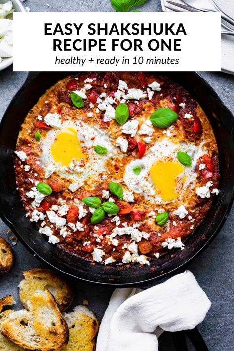 Shakshuka for One, or poached eggs in tomato sauce, is a hearty and saucy breakfast or brunch that's packed with flavor! It's quick and easy to make, and ready in just 20 minutes! You can make it with either fresh or canned tomatoes, so you can enjoy this North African dish all year round! Shakshuka With Feta, Easy Shakshuka Recipe, Tomatoes Eggs, Toasted Baguette, Shakshuka Recipes, Iron Skillet Recipes, Wakey Wakey, Feta Recipes, Cast Iron Skillet Recipes