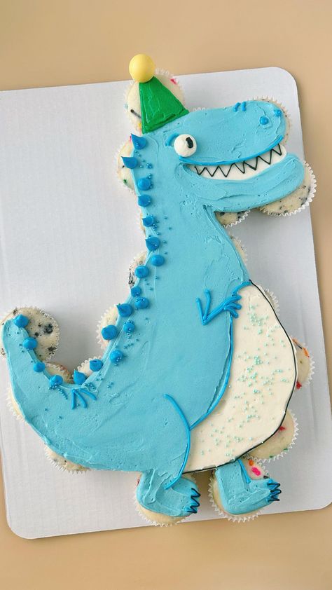 This Dino is ready to party 🦖🥳 . . . #pullapartcupcakes #pullapartcupcakecake #cupcakecake #pullapartcake #dinoparty #dinosaurcake… | Instagram Cupcake Cakes Pull Apart Dinosaur, T Rex Pull Apart Cupcakes, Pull Apart Cupcake Cake Dinosaur, Easy Dino Cupcakes, Dinosaur Birthday Cupcake Cake, Dino Pull Apart Cupcakes, Trex Cupcake Cakes, 3rex Birthday Cake, Dinosaur 2nd Birthday Cake