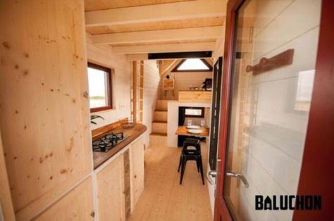 Baluchon’s Incredibly Cozy Tiny House Features a Warm and Rustic Color Scheme - Previously on our tiny house blog, we have featured The Avonlea, a tiny house designed by French architect Baluchon. Now I want to share yet another of Baluchon’s incredible designs with you—another gorgeous tiny house called L'Odyssée! Rustic Color Schemes, Red Windows, Tiny House Towns, Tiny House Company, Tiny House Talk, Tiny House Builders, Tiny House Movement, Tiny Houses For Sale, Cabin In The Woods