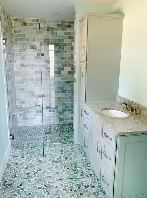 Blue Pebble Tile Shower Floor, Seaside Bathroom Ideas, Shower Curbless, Pebble Tile Shower Floor, Pebble Flooring, Blue And Grey Bathroom, Pebble Tile Shower, Seaside Bathroom, Rock Shower