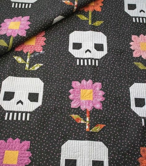 Be the talk of the graveyard with this hauntingly sweet skull-and-flower quilt pattern. This design is perfect for Halloween, Dia de los Muertos, or any time you crave a bit of spooky patchwork. It’s sure to make a lasting impression with its eye-catching design and irresistible charm. This is a quilt that is truly “to die for.” Finished Block: 16” x 16” Finished Quilt: 80-1/2” x 80-1/2” Skill Level: Intermediate #quiltersgonnaquilt #sewersgonnasew#igquiltingcommunity #quiltsofinstagram #... Modern Boy Quilt, Pushing Up Daisies, Skull Quilt, Quilt Binding Tutorial, Flower Quilt Patterns, Charm Pack Quilt, Sunflower Quilts, Swap Gifts, Jelly Roll Quilt Patterns