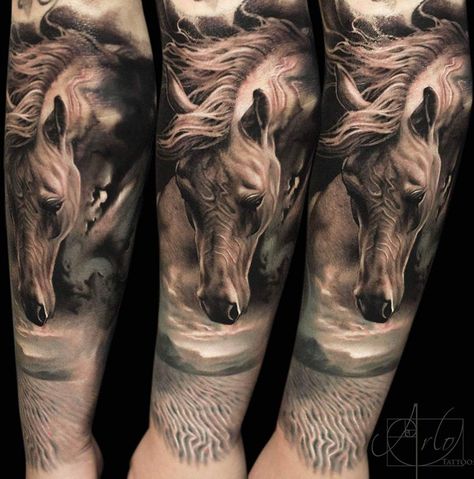 Horse and desert dream piece done on woman's forearm. The sandy desert starts on the wrist with mountains in the background and a horse with it's mane flowing in the wind. This tattoo is by Arlo DiCristina. Arlo Tattoo, Horse Tattoo Ideas, Tattoo Lower Back, Horse Tattoos, Desert Horse, Horse Tattoo Design, Petit Tattoo, Western Tattoos, Geniale Tattoos