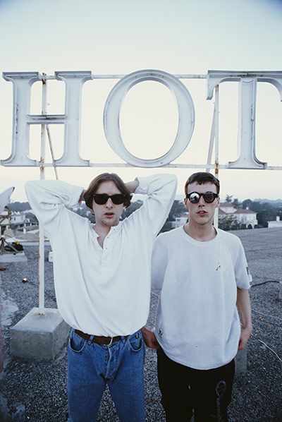 Shaun Ryder and Bez of the Happy Mondays on the roof of the Hotel Subur Maritim, Sitges, Spain, March 1990 Photograph: Kevin Cummins/Getty Images Bez Happy Mondays, Acid House Rave, Sitges Spain, Happy Mondays, Stone Roses, Acid House, 90s Music, Joy Division, Sitges