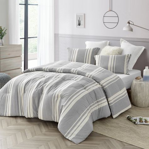 Choose from available size options. Set includes comforter and 2 shams (1 sham with Twin XL sizes). Made from 100% yarn-dyed cotton. 280 GSM polyester fill. 2-in. flange trim on sham(s). Machine wash cold. Experience the refreshing comfort of the Cirbus Gray Stripes 100% Yarn Dyed Cotton Comforter by Byourbed. This comforter set's gray and cream stripes are made from 100 percent cotton with 280 GSM (grams per square meter) polyester fill.King and Queen sizes each include one comforter and two sh Striped Comforter, Striped Bed, Stylish Farmhouse, Men Bed, Full Size Comforter Sets, Bedding Comforter Sets, Full Size Comforter, King Size Comforter Sets, Grey Comforter Sets