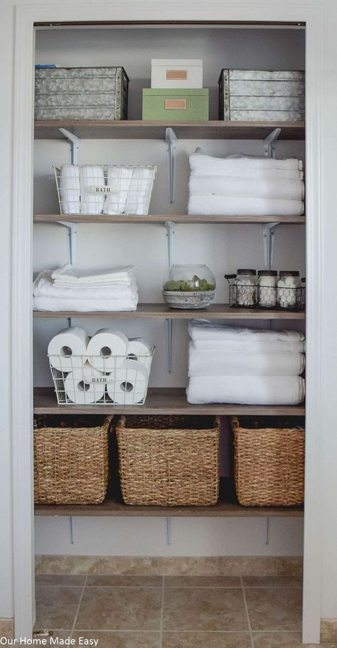 A DIY but custom shelving system for a linen closet makeover. Check out the organizational ideas and how to DIY your own shelves! Bathroom Closet Shelving, Narrow Closet Organization, Bathroom Closet Storage, Neat Closet, Linen Closet Makeover, Bathroom Linen Closet, Bathroom Closet Organization, Closet Hacks Organizing, Custom Shelving