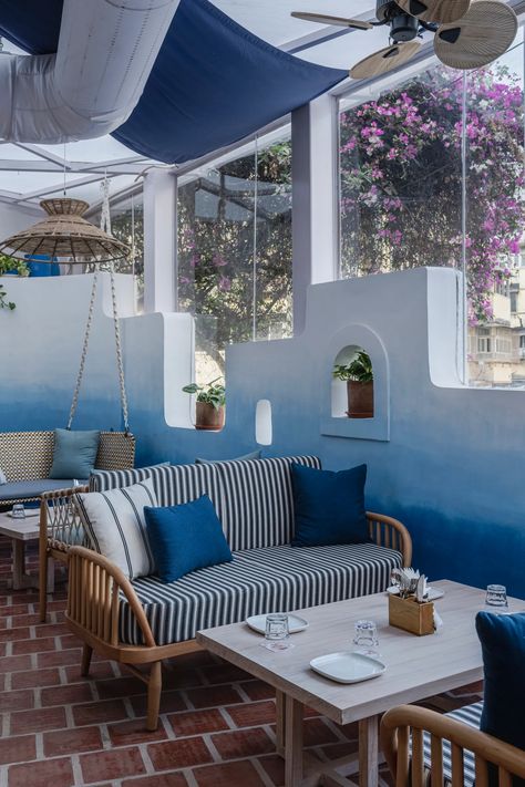 A new restaurant in Mumbai's Pali Hill designed by Minnie Bhatt Design Studio summons the lulling beauty of a gorgeous Greek island. Greek Style Restaurant Design, Greek Cafe Interior Design, Santorini Cafe, Santorini Restaurants, Greek Cafe, Greek Restaurant, Greek Restaurants, Leo Season, New Restaurant