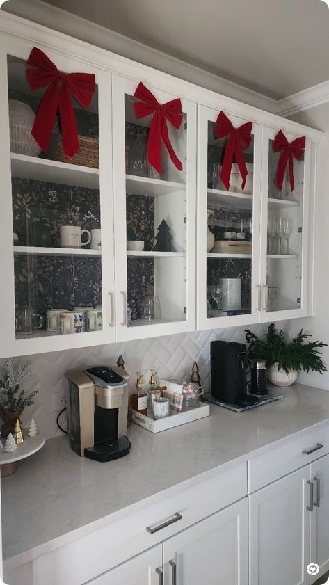 I added some simple red bows to my Butler's pantry cabinets and I love how they look above our coffee bar. 😍 Walmart fines, Walmart Christmas, red bows, Christmas decor, Walmart Christmas decorations Follow me in the @LTK shopping app to shop this post and get my exclusive app-only-content! #liketkit #LTKSeasonal #LTKHoliday #LTKhome @shop.ltk https://liketk.it/4r3gS Cabinet Bows Christmas, Above Cabinet Decor, Walmart Christmas, Christmas Decorations Apartment, Above Cabinets, Pantry Cabinets, Bows Christmas, Christmas Apartment, Red Wreath