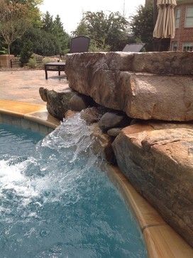 Pool jump rock with water Pool Waterfall Jumping Rock, Jumping Rocks For Pool, Front Foor, Swimming Pool Waterfall, Pool Kitchen, Pool Landscape Ideas, Inground Pool Designs, Swimming Pool Pond, Cheap Pool