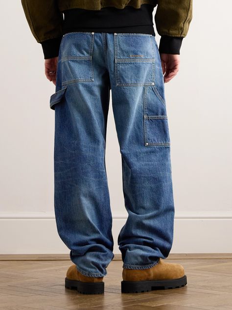 Givenchy's 'Carpenter' jeans are a nod to traditional workwear. Crafted in Italy from panels of rigid denim, they're detailed with a hammer loop and the brand's embroidered logo at the back pocket. Carpenter Outfits Men, Carpenter Jeans Outfit Men, Jeans Pocket Design, Wardrobe Overhaul, Jean Pocket Designs, Jeans Outfit Men, Thrift Inspo, Workwear Brands, Blue Jeans Mens