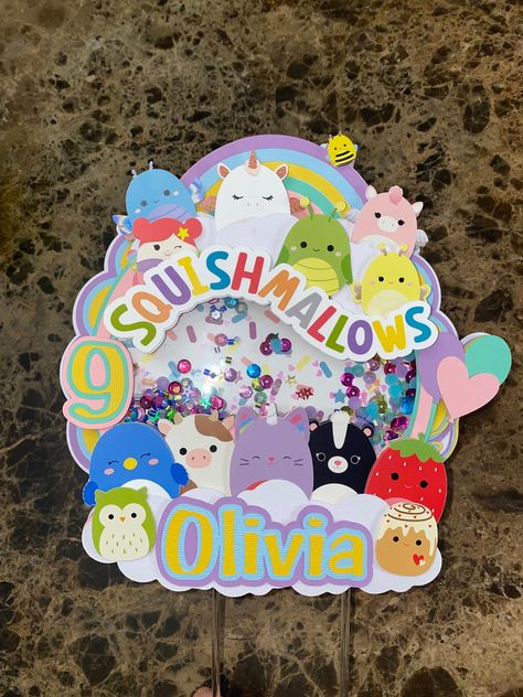 "**This cake topper is perfect for a squishmallow theme celebration. **Cake topper is one sided Materials: -Made with high-quality cardstock paper -Attached to an acrylic stick **Cake topper measure approximately  - 8.5 wide x 8.5\" tall **Those measurements do no include the approximate 5\" of the acrylic stick** **It takes about 2-3 days to get the cake toppers together and then once complete it will be shipped with USPS   -Please take into consideration the 2-3 day processing time before placing the order. * If original color is unavailable a similar color will be used** *The color may vary slightly as all monitors pick up color differently.** *I do not accept returns on this product. However if you have an questions or concerns please send me a message and we can talk it over. COPYRIGH Squishmallow Cake, Squishmallows Party, Birthday Topper, Celebration Cake, Paper Photo, Random Ideas, 8th Birthday, One Sided, Cardstock Paper